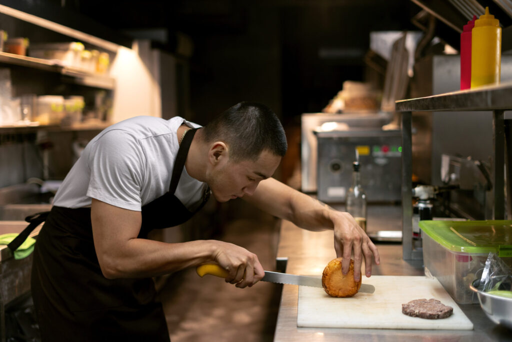 chef-cooking-kitchen-while-wearing-professional-attire